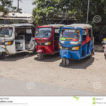 people-cars-road-auto-rickshaw-tuk-tuk-street-tanzania-typical-scene-africa-96844227